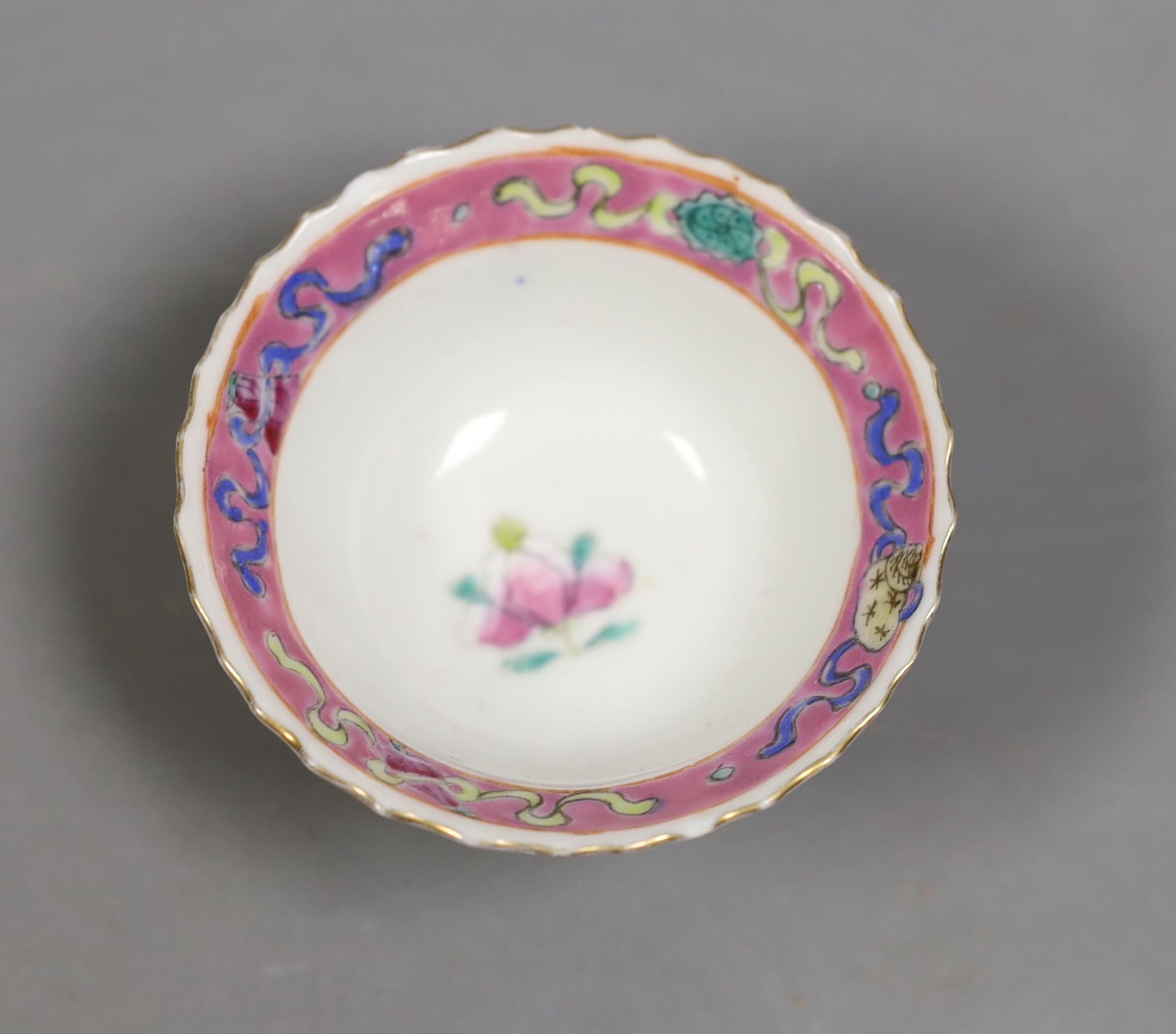 A Chinese Straits famille rose tea bowl, 7 cms diameter.